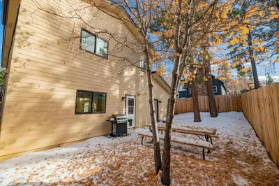 a bench in the snow next to a building at Modern Times - Amazing place with super open concept! Jet tub! in Big Bear Lake