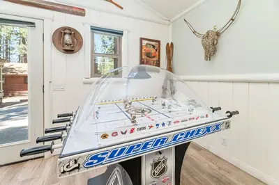 a speed boat in a room with a table at Summit Mountain Lodge - Amazing location just down the street from Snow Summit! in Big Bear Lake