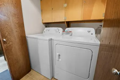 a white washer and dryer in a small room at Summit X-ross Roads - Just a short drive to the Village and the lake with forest views! in Big Bear Lake