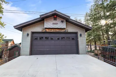 a garage door in a house at North Shore Lakefront - Spacious Lakefront with Hot Tub, & Game Room in Fawnskin