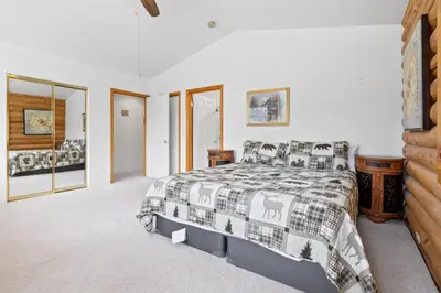 a bedroom with a bed with a horse blanket at Bear Bait - Lots of games, televisions, beds, telescope, and 3 bathrooms in Big Bear Lake