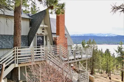 a house with a staircase leading up to a house at Best View - Spacious home with game room, and 180 degree panoramic view of Big Bear Lake! in Fawnskin