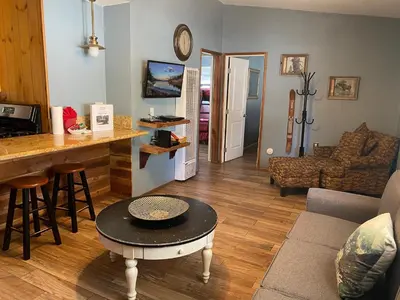 a living room with a counter and a table at Honey Bear - Close to lake and village in Big Bear Lake