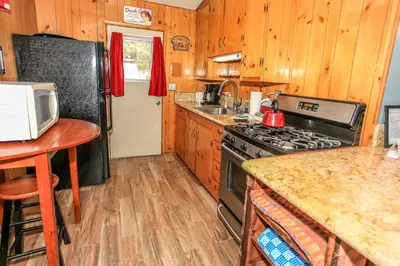 a kitchen with a stove and a counter top at Honey Bear - Close to lake and village in Big Bear Lake