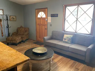 a living room with a couch and a table at Honey Bear - Close to lake and village in Big Bear Lake