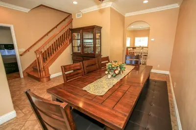 a dining room with a wooden table and chairs at Lakeview Court Castle - Short walk to the Village and lake in Big Bear Lake