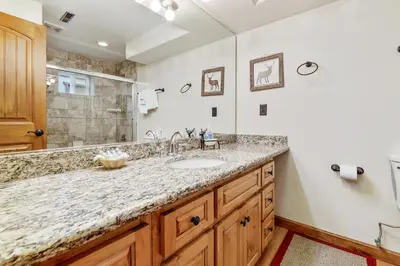 a bathroom with a sink and a shower at Mallard Landing - Steps from the marina and minutes from the Village in Big Bear Lake