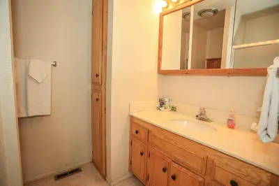 a bathroom with a sink and a mirror at Summit Getaway Condo - Affordable and ideally located, Wood burning fireplace! Walk to Ski Resort in Big Bear Lake