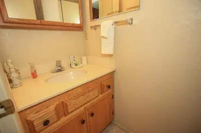 a bathroom with a sink and a mirror at Summit Getaway Condo - Affordable and ideally located, Wood burning fireplace! Walk to Ski Resort in Big Bear Lake