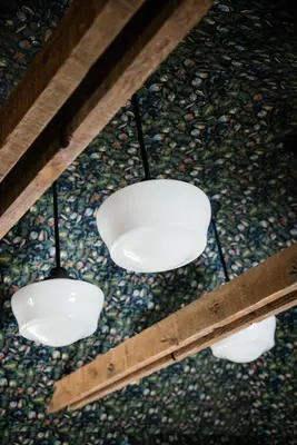 a group of three lights hanging from a ceiling at The Richland in Orange