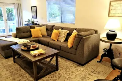 a living room with a couch and a coffee table at Stylish 4 Bedroom Home Near Venice Beach with Backyard BBQ in Los Angeles