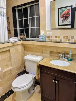 a bathroom with a toilet and a sink at Stylish 4 Bedroom Home Near Venice Beach with Backyard BBQ in Los Angeles