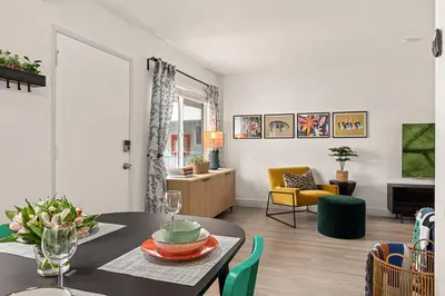 a living room with a table and a dining room at East Village Arts District, King Suite with Sofa Bed NRP23-01221 in Long Beach
