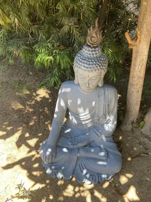 a statue of aitating woman sitting in the grass at Stunning Hollywood Midcentury Modern-Views-Best Location! in Los Angeles