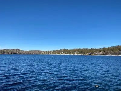 a large body of water with trees in the background at The Inspo Cabin with Stunning View in Running Springs