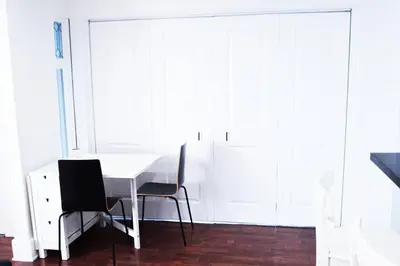 a white table and two chairs in a room at Villa by the Ocean in Venice Beach in Los Angeles