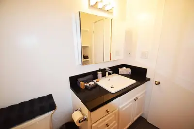 a bathroom with a sink and a mirror at Villa by the Ocean in Venice Beach in Los Angeles