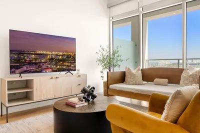 a living room with a couch and a large window at #Marbella Lane - Panoramic Delight Dream Escape! in Long Beach