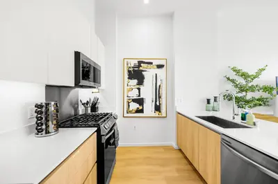 a kitchen with white counters and a black stove at #Marbella Lane - Panoramic Splendid Ocean Views! in Long Beach