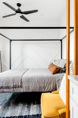 a bedroom with a bed and a ceiling fan at Vibe on the Patio at a Modern Luxury Studio near LAX Beach in Los Angeles