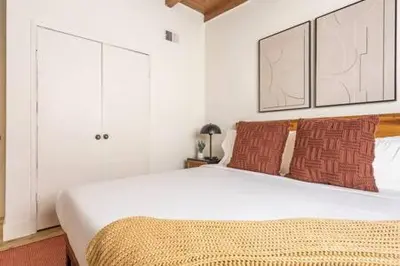 a bedroom with a large white bed with two pillows at Steps to Beach Manhattan Beach 2 Bedroom Parking in Manhattan Beach