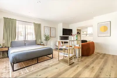a living room with a bed and a couch at Steps to Beach Manhattan Beach 2 Bedroom Parking in Manhattan Beach