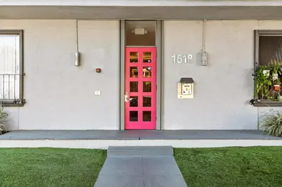 a red door on the side of a building at Double King Suite with Patio Dining and Parking NRP21-00386 in Long Beach