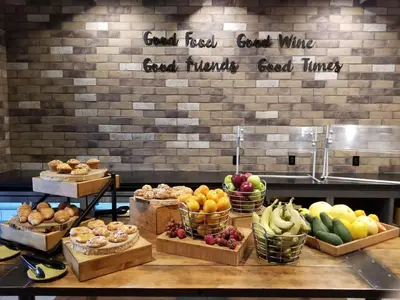 a bunch of fruits and vegetables in baskets on a counter at Doubletree By Hilton Pomona in Pomona