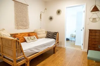 a living room with a couch and a table at Villa La Verde - Newly Designed 4BR Villa with Pool & Guesthouse by Topanga in Los Angeles