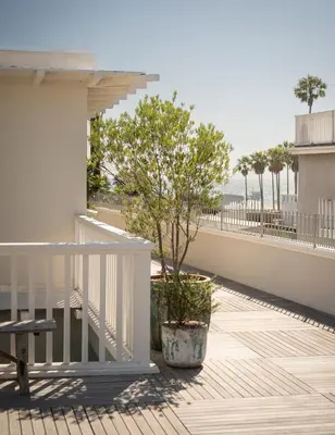 a balcony with a tree and a white railing at Gjelina Hotel in Los Angeles