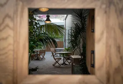 a view of a room with tables and chairs at Gjelina Hotel in Los Angeles