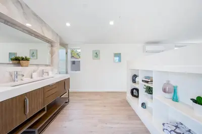 a bathroom with two sinks and a large mirror at Day Dreams by AvantStay in Los Angeles