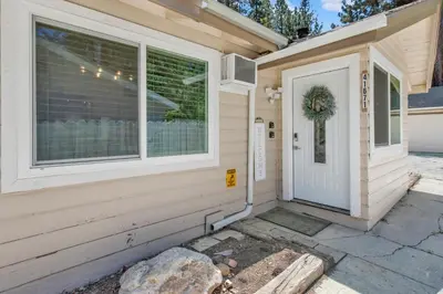 a front door of a house with a wreath on it at Sweet Retreat 2- Cozy Relaxing Resort Cottage in Big Bear Lake