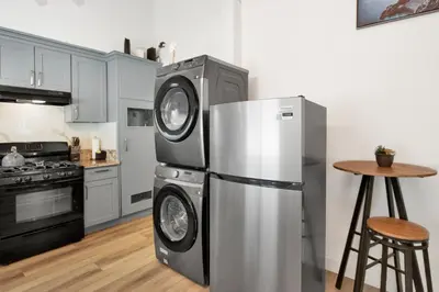 a kitchen with a stainless steel refrigerator and a stove at Sweet Retreat 2- Cozy Relaxing Resort Cottage in Big Bear Lake