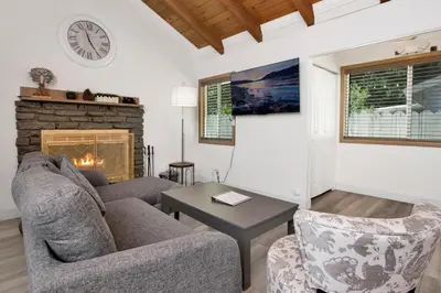 a living room with two couches and a fireplace at Sweet Retreat Combo- Relaxing Resort Cottage Combo in Big Bear Lake