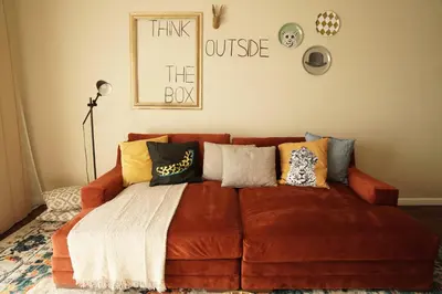 a couch with pillows on it in a living room at Lux Oasis in West Hollywood, Free Parking & Swimming pool in Los Angeles