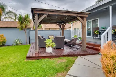 a wooden deck with a pergola on a house at Inglewood Vacation Rental 2 Mi to Sofi Stadium in Inglewood