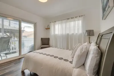 a white bedroom with a bed and a window at Inglewood Vacation Rental 2 Mi to Sofi Stadium in Inglewood