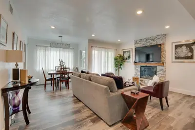 a living room with a couch and a fireplace at Inglewood Vacation Rental 2 Mi to Sofi Stadium in Inglewood