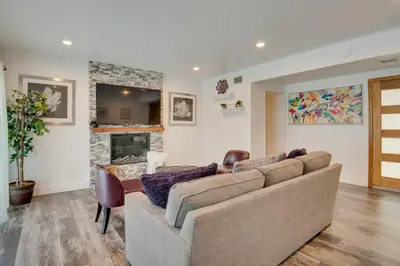 a living room with a couch and a fireplace at Inglewood Vacation Rental 2 Mi to Sofi Stadium in Inglewood