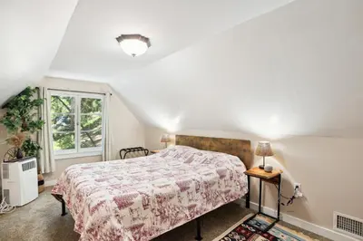 a bedroom with a bed and a window at Twin Peaks Vacation Rental with Hot Tub! in Twin Peaks