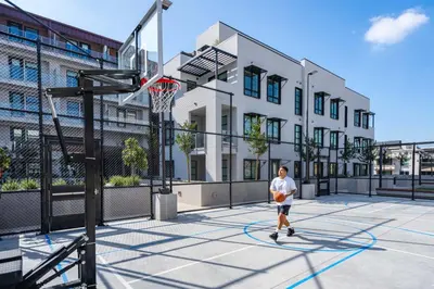 a man is playing basketball on a basketball court at Level Hollywood in Los Angeles