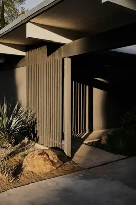 a side view of a house with a fence at Eichler Mid Century Modern Designer Pool/Jacuzzi in Thousand Oaks