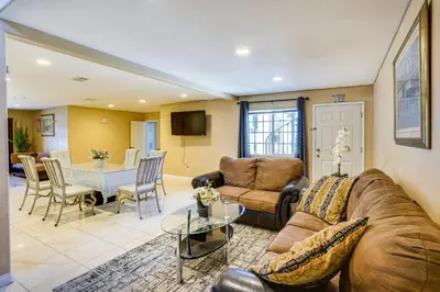a living room with a couch and a table at Westminster Apartment Near Beaches and Theme Parks! in Westminster