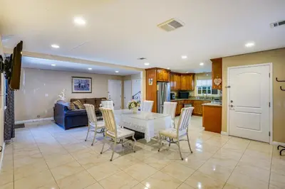 a kitchen and dining room with a table and chairs at Westminster Apartment Near Beaches and Theme Parks! in Westminster