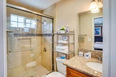 a bathroom with a shower and a toilet and a sink at Westminster Apartment Near Beaches and Theme Parks! in Westminster