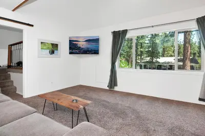 a living room with a couch and a table at Maltby Modern Log Cabin Relaxing Chalet Retreat in Big Bear Lake
