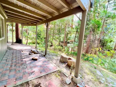 an empty porch of a house with a wooden roof at Family Friendly A Frame, Pets stay Free! in Lake Arrowhead