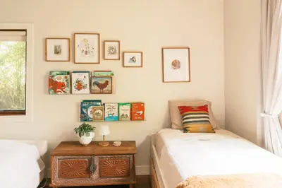 a bedroom with two beds and a table with a night stand at Casa Superba - Peaceful Sanctuary in Venice in Los Angeles
