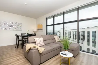 a living room with a couch and a table at Spacious 3Bedroom Apt close to LAX & Sofi Stadium* in Los Angeles